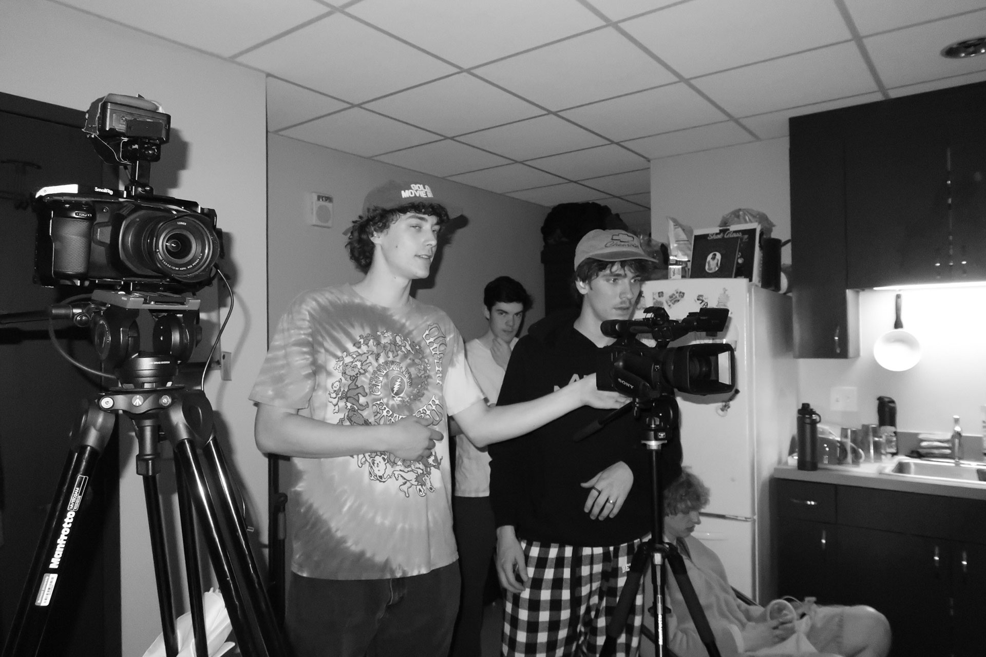 Erickson Thole on set behind two cameras during a shoot